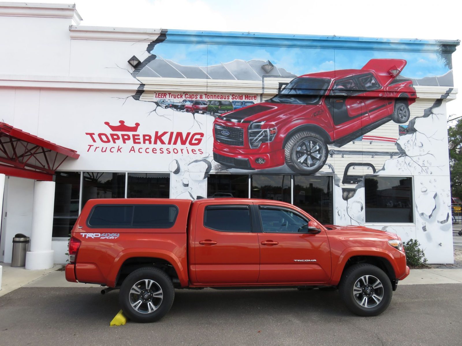 2017-orange-toyota-tacoma-ranch-sierra-topper-side.jpg