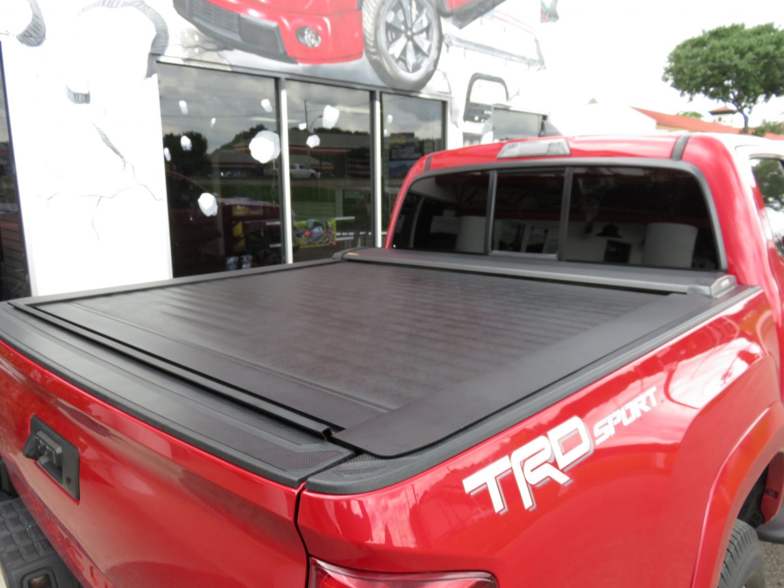 2017-red-toyota-tacoma-leer-ricochet-cover.jpg